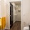 Model bathroom at our apartments for rent in Richmond, featuring granite patterned countertops and a walk in closet.