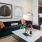 Model living room at our apartments for rent in Richmond, TX, featuring couches and wood grain floor paneling.