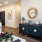 Model living room at our apartments for rent in Richmond, TX, featuring modern decor and wood grain floor paneling.