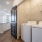 The laundry closet at our apartments for rent in Richmond, featuring in unit front loading washers and dryers.