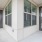 Doorways from the balcony of one of our apartments for rent in Richmond, TX, featuring windows with blinds.